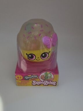 Shopkins Yellow & Pink Squeezkins Character with Purple Bow